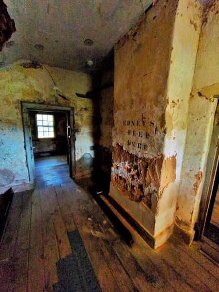 The opposite wall. On it is written: "Edney's feed here" over some exposed bricks where presumably there was a feed holder. I wonder if Edney was a cow or a sheep or a horse? Or some other kind of animal?