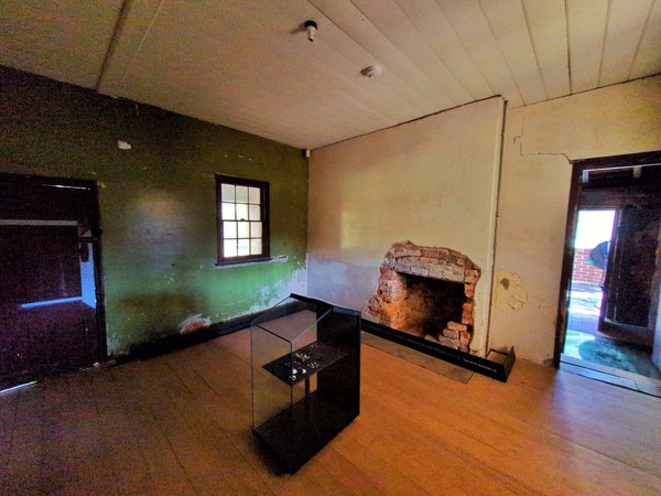 Another view of the main room. There's a fireplace in one of the cream walls.